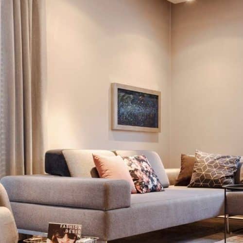 Luxury living room featuring coordinated Venetian, Roman, and curtain blinds designed by Aqua Blinds and Screens in Brisbane and Gold Coast